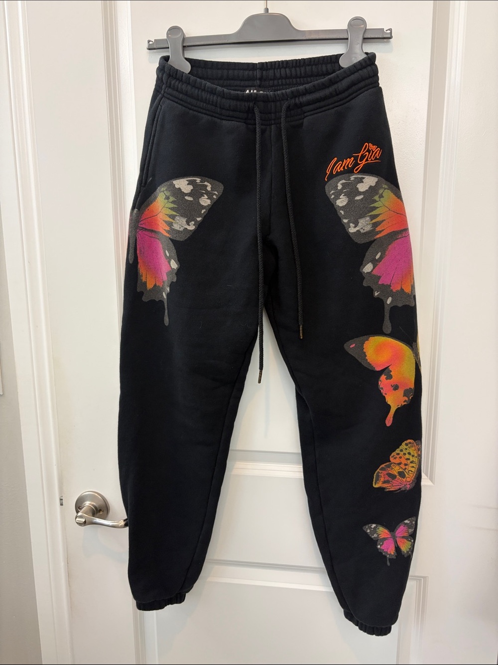I.AM.GIA Black Joggers with Neon Butterfly Graphics